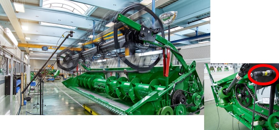 The sensor system inspects the rotating cutting unit of a combine harvester for defective vibrations or noises by means of structure-borne sound sensors (detailed view of the sensor see right image) and microphones. Image in print quality see: www.izfp.fraunhofer.de/de/Presse/pressefotos.html